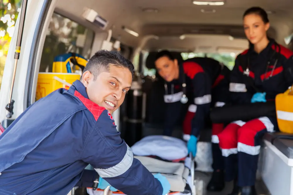 First responder preparing equipment after a call illustrating repeated occupational trauma exposure