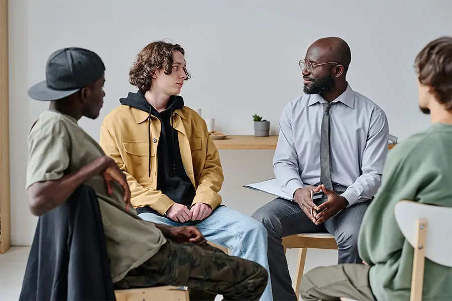Group therapy session for adolescents