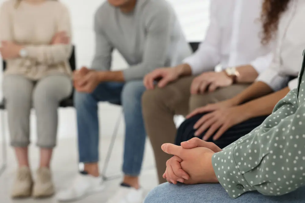 Participants learning mindfulness and emotional regulation skills in a DBT group therapy session.