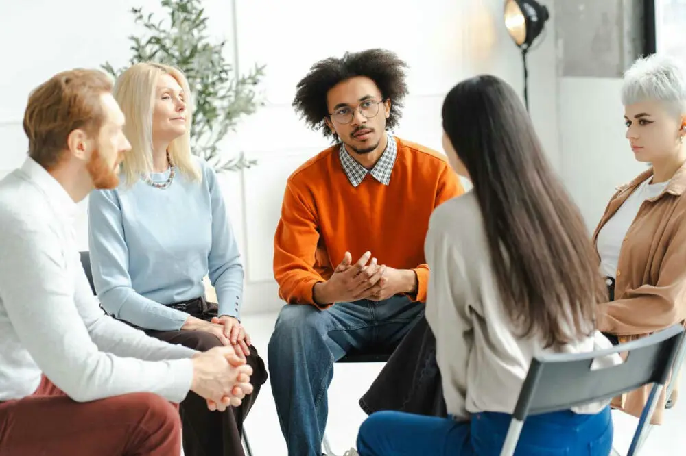 a-group-of-individuals-in-a-therapy-session