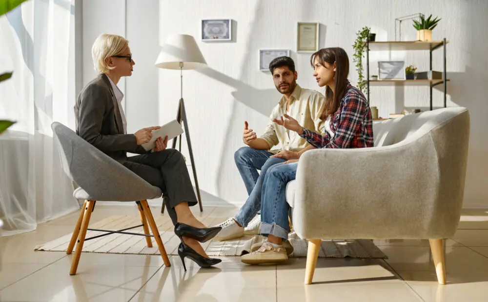 a-couple-speaking-to-therapist-in-session