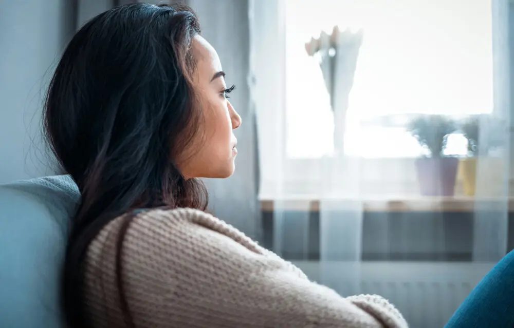 a-woman-staring-out-the-window