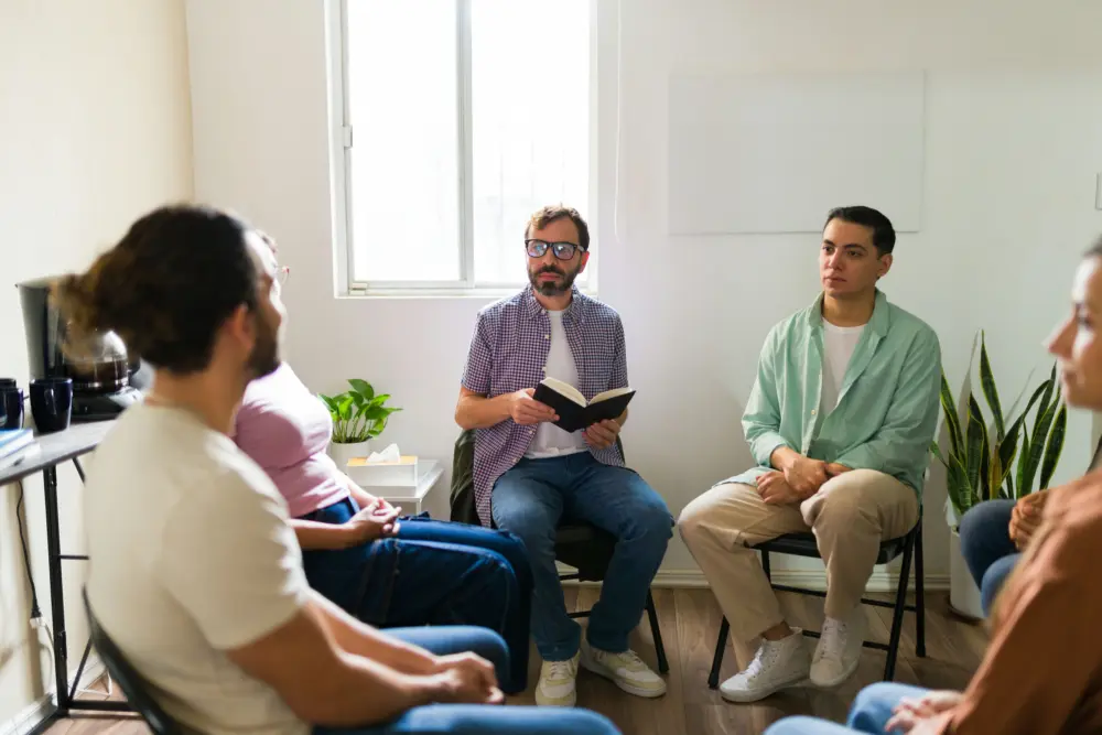 a-therapist-speaking-to-individuals-in-group-therapy