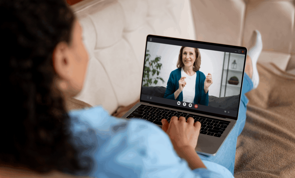 young woman talking to therapist via telehealth