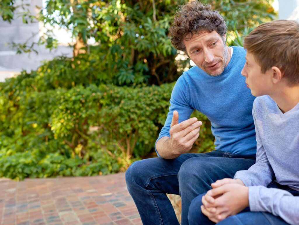 Parent having a conversation with their teen about substance use and mental health